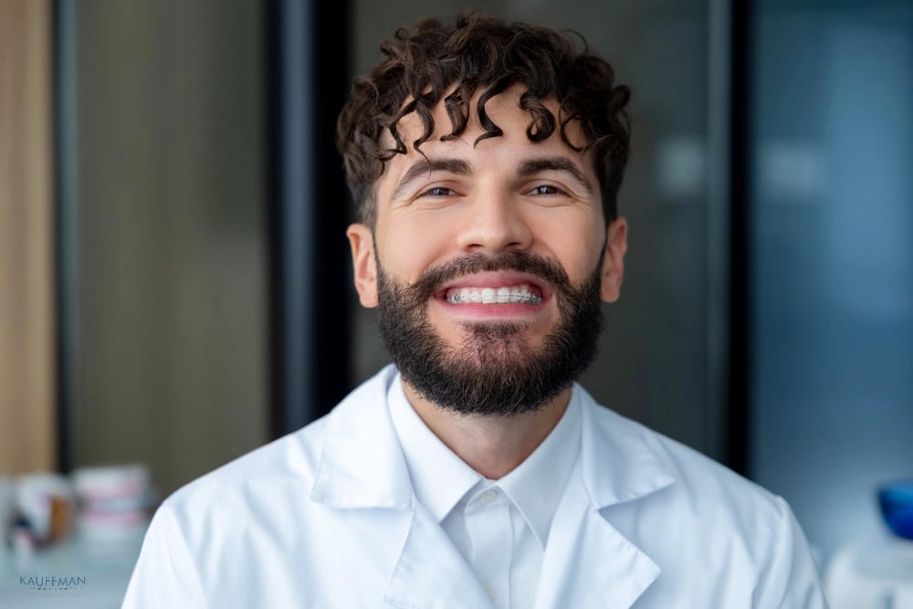 a man smiling about clear braces wondering abour braces cost in new braunfels, tx
