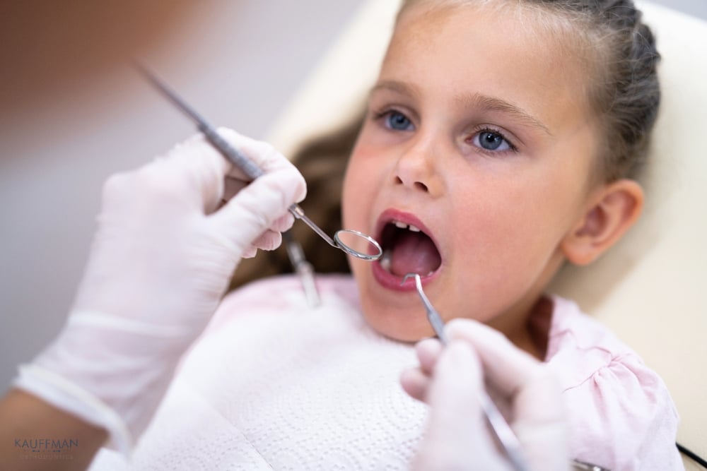 children visiting dentist mouth orthodontist checkup treatment as one of the procedures of how to fix overbite in new braunfels, tx
